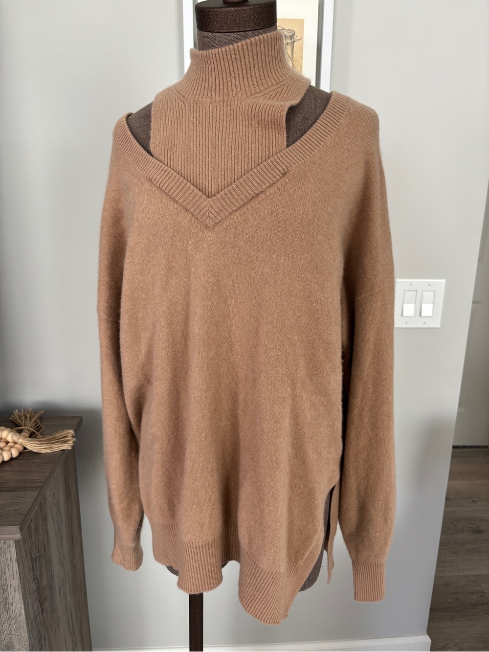 This is a NAADAM Cut Out Cashmere Turtleneck in camel XL